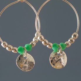 Indian earrings with medal and pearls green color